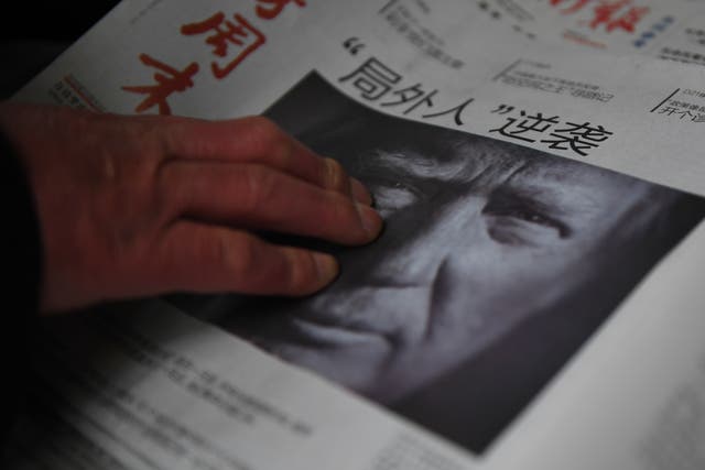 <p>File A Chinese newspaper on sale, with the headline that reads “Outsider strikes back”, featuring Donald Trump on the front page in Beijing on 10 November, 2016</p>
